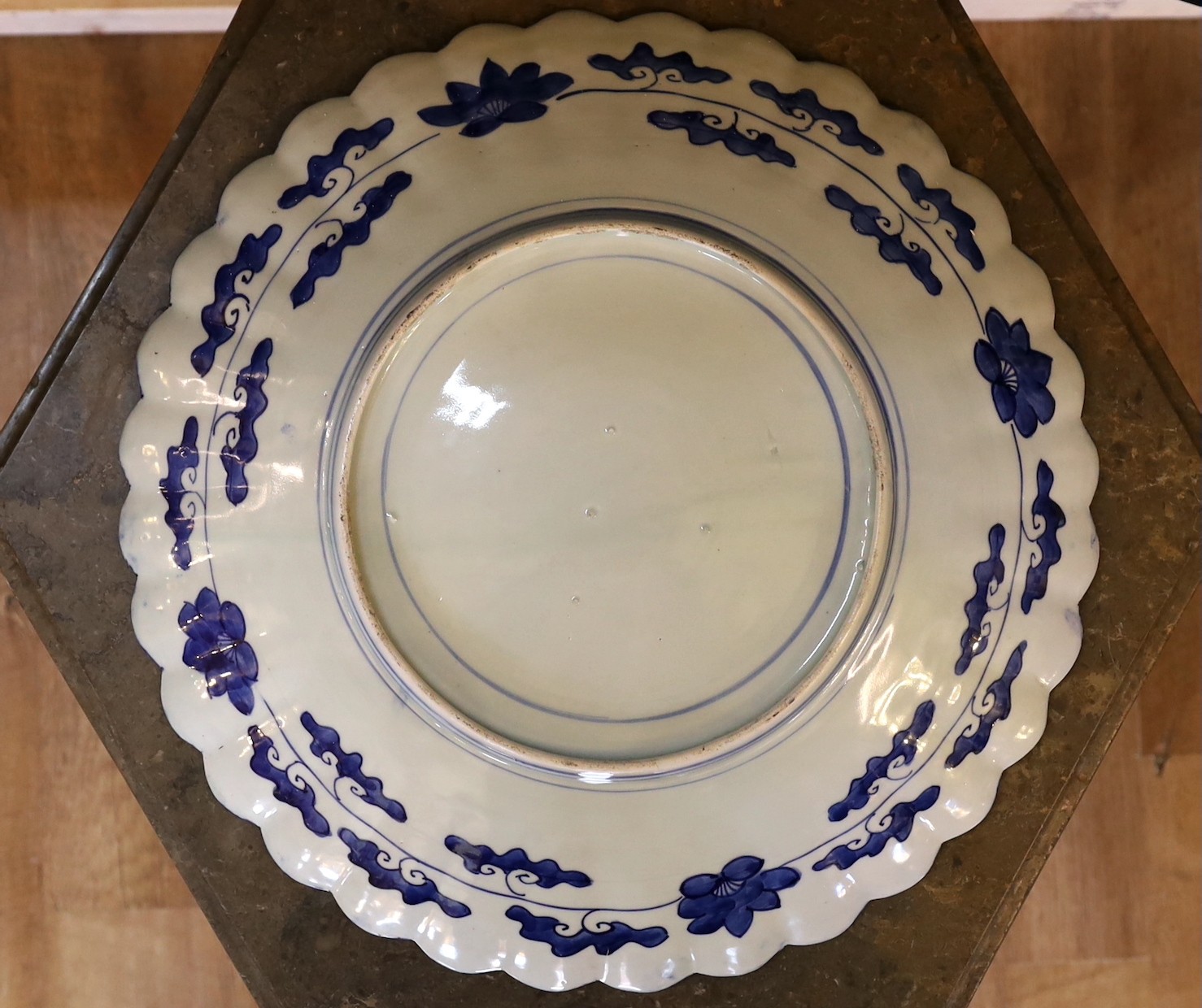 An Imari charger decorated with a central panel of flowers in a vase within floral borders, diameter 47 cm